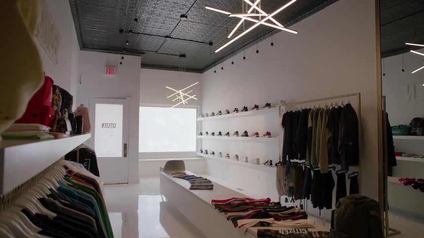 The store is full of clothing items, but no people