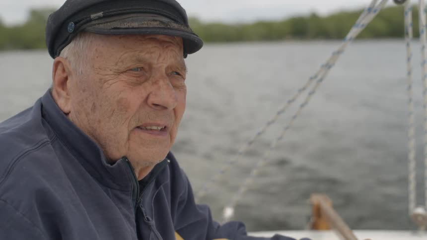 An old man is sailing