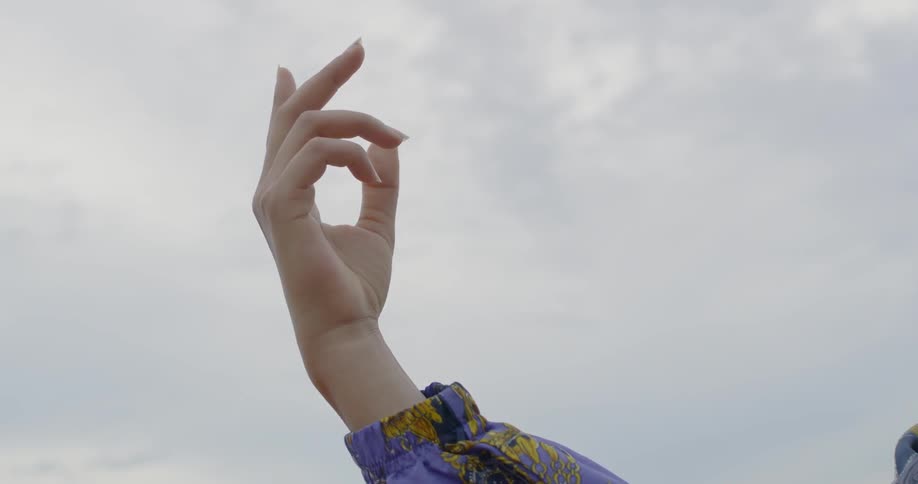 A woman dances abstractly outside