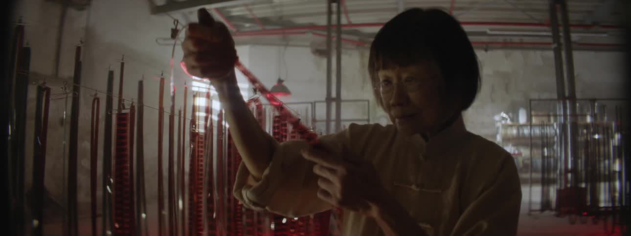 Woman holds and looks at a filmstrip