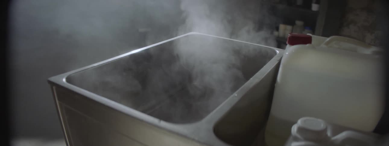 Steams rises from a pan of hot water