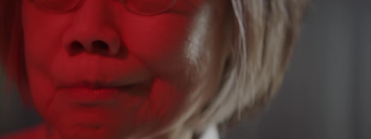 Elderly woman closes her eyes and cries