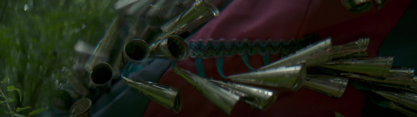 Metal adornments on a piece of clothing sway and bounce