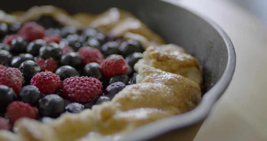 Steam pours off of a berry pie