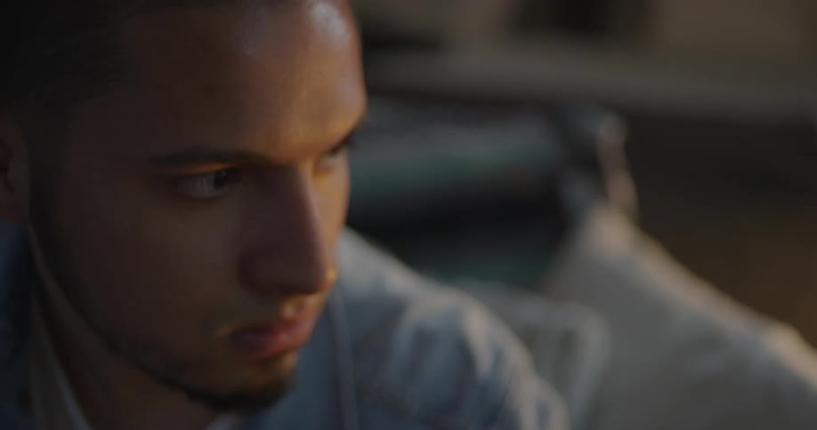 A man is nodding his head looking to the side