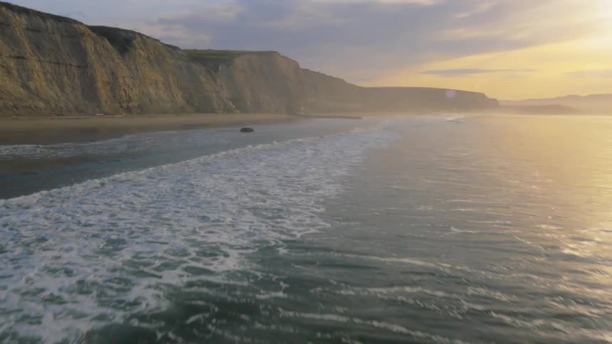 The tide flows onto the shore