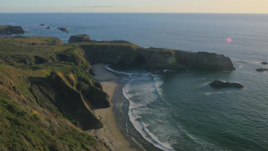 Waves flow onto the beach shore