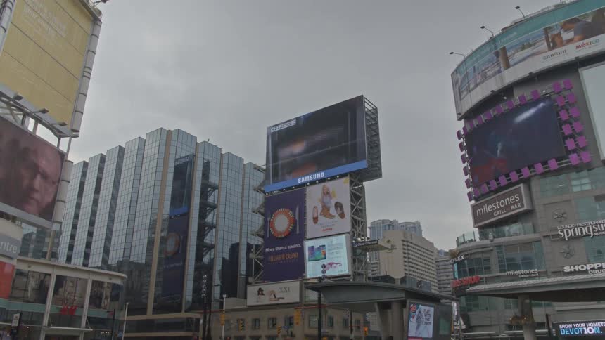 Timelapse of flashing neon lights, signs, and video billboards