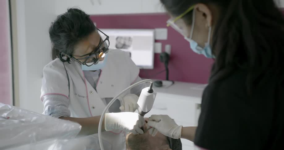 Dentist works on a patient