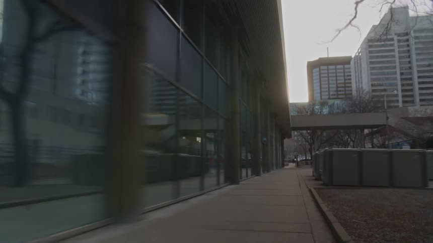 Passing by a building quickly