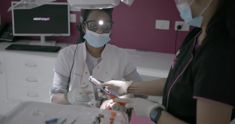 Dentist works on a patient's teeth