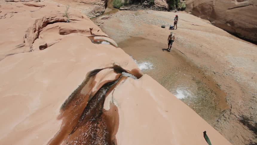 Man walks into a small pool of water