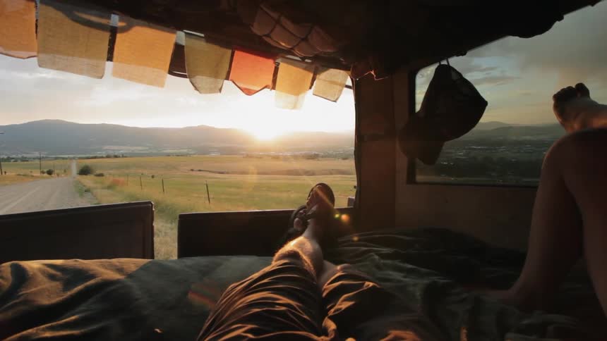 People are resting in the vehicle by the roadside