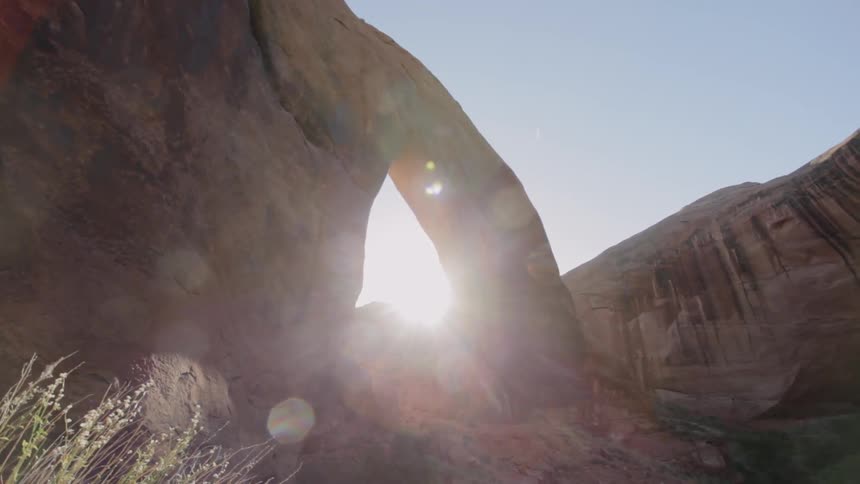 Sunlight shines through a rock archway