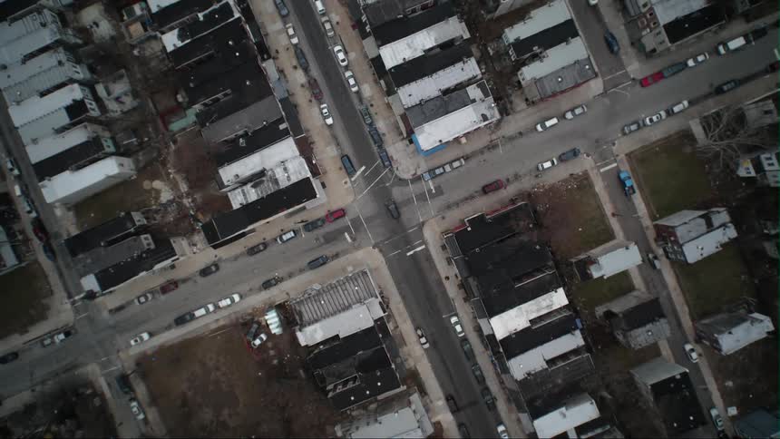 Parked cars line a city street