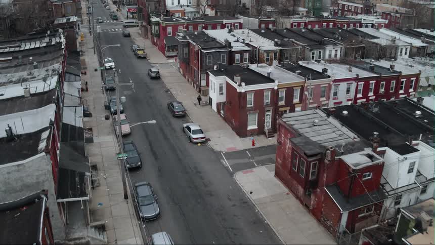 Parked cars line a city street