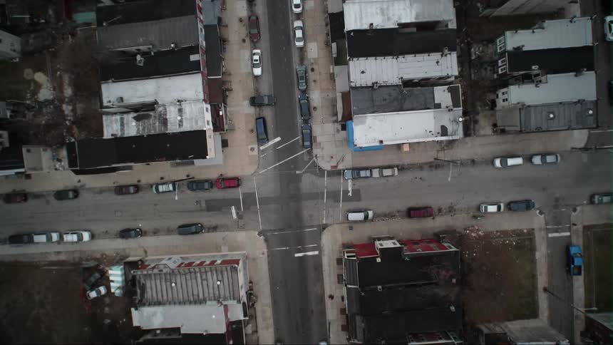 A vehicle below pulls out of a parking lot