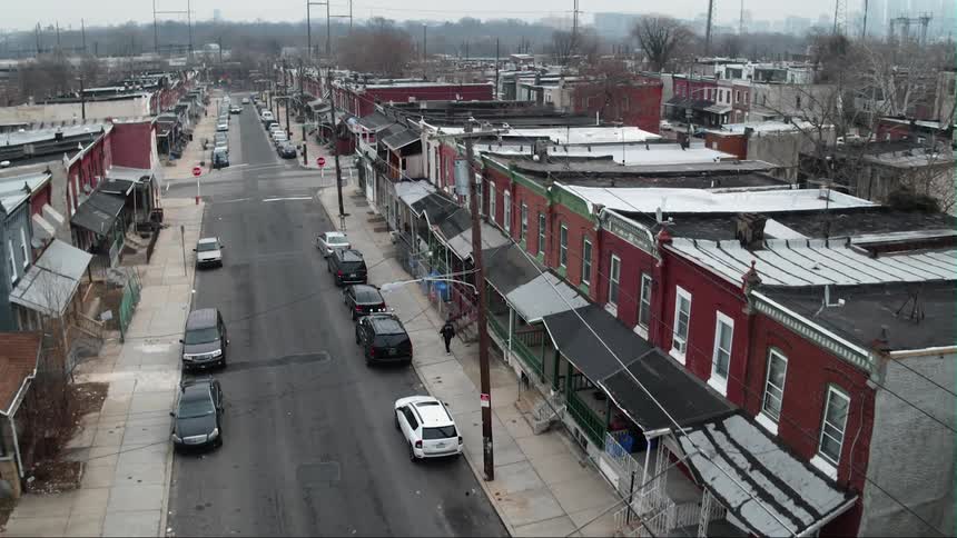 Parked cars line a city street