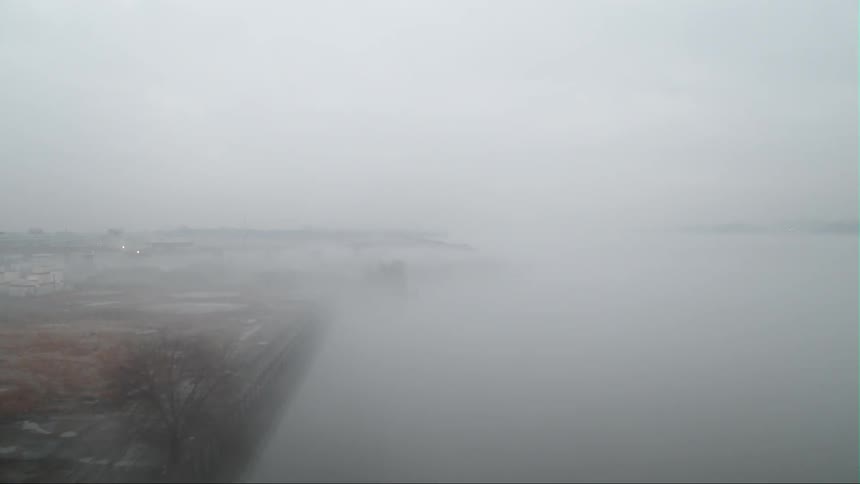 Fog floats around an industrial building