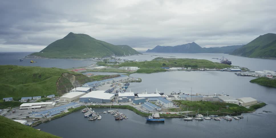 Boats are docked in a port