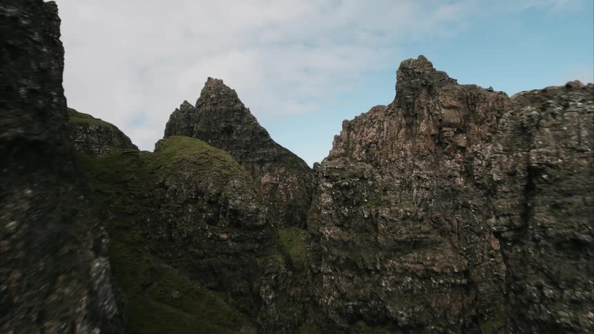 Rocky cliffs against a cloudy sky
