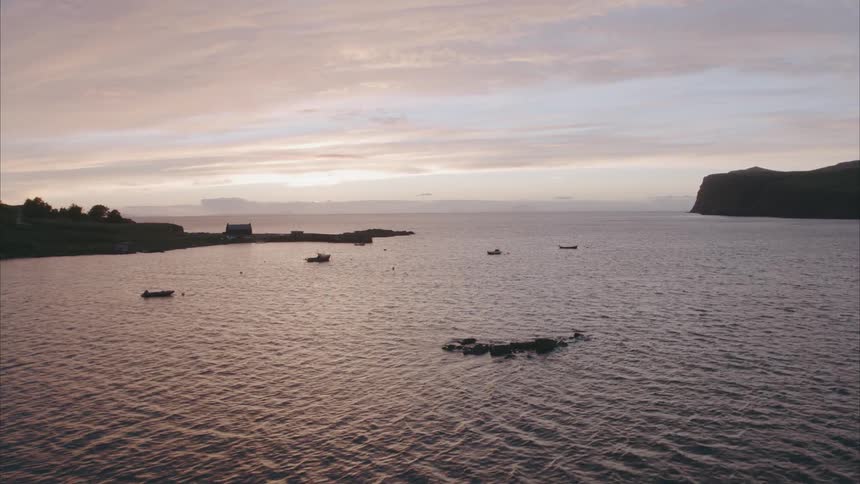 A large body of water at sunset