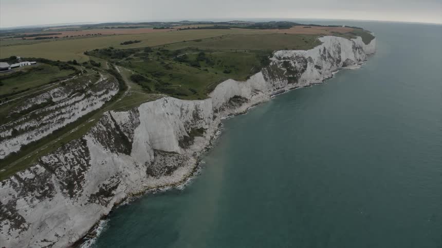 A cliff borders the sea