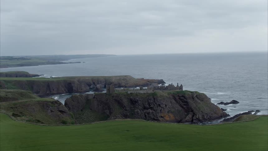 Castle ruins are next to the ocean