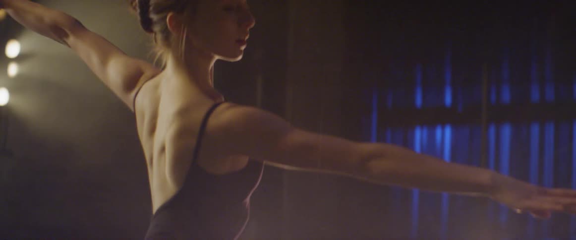 A ballerina dances on stage