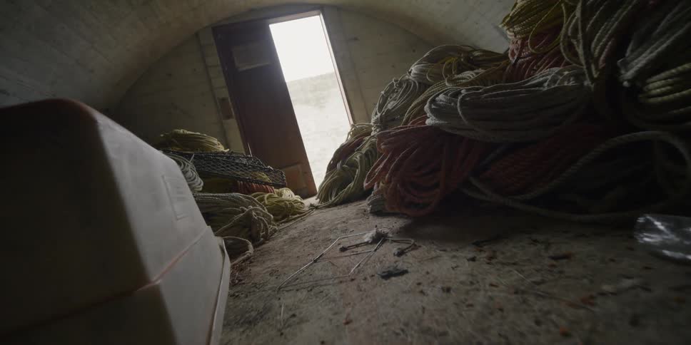 Ropes and cables lay in a storage container