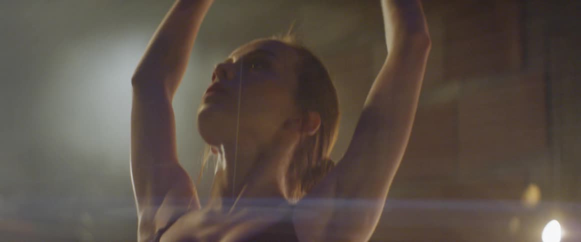 A ballerina dances on stage