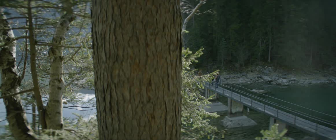 People are walking across a bridge