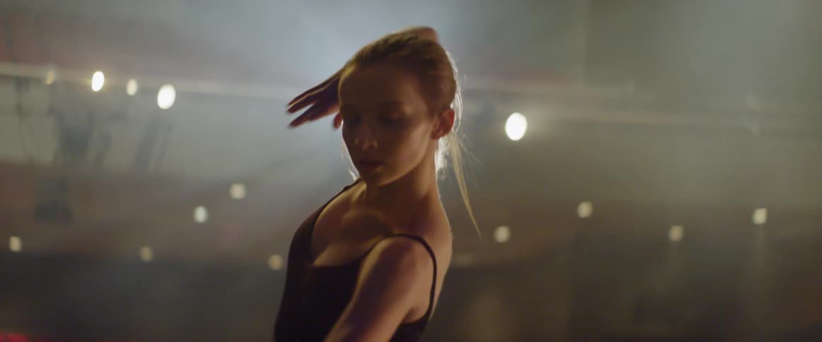 A ballerina dances on stage