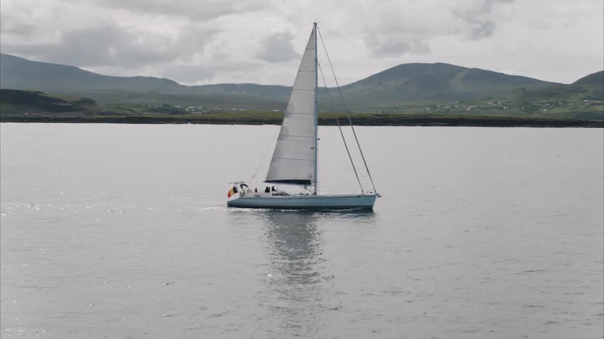 A sailboat floats on a lake