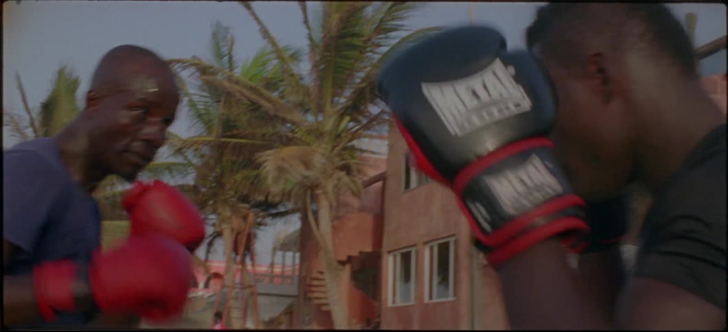 The boxers spar outside on the beach