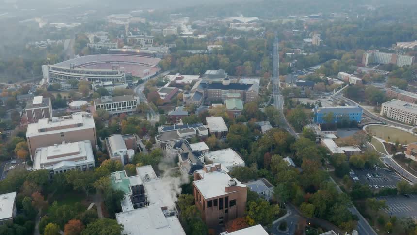 An aerial view of a city covered in haze