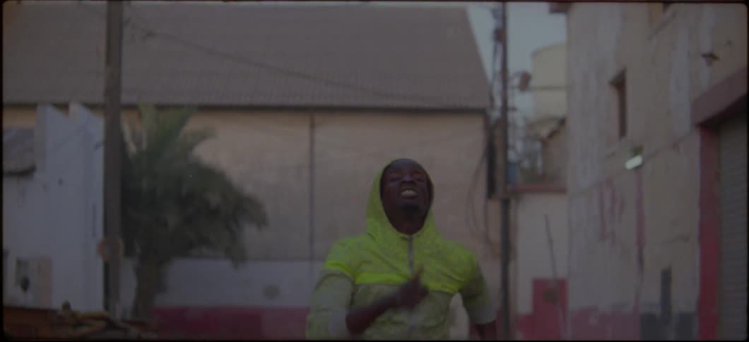 Man sprints outside in a city