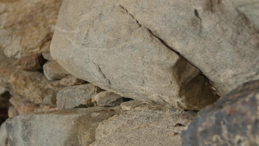 The large boulders are stacked into a wall