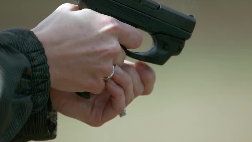 Person firing a handgun