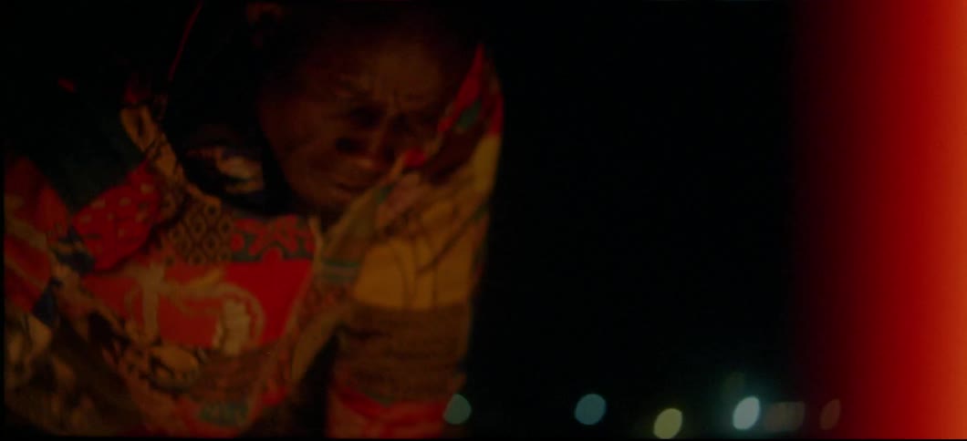 Someone is playing drums by the campfire