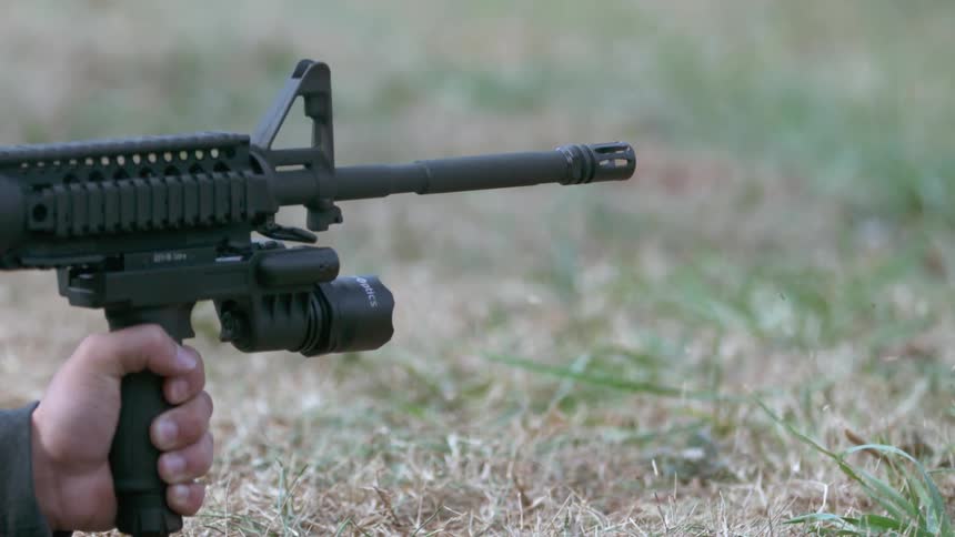 A gun is fired close to the ground