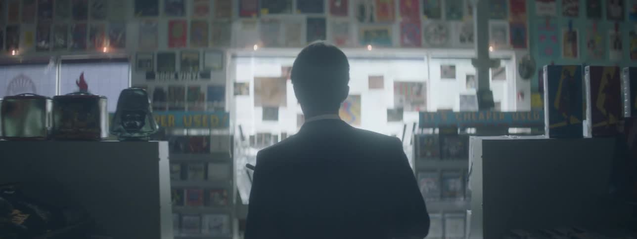 A person walks through a video store