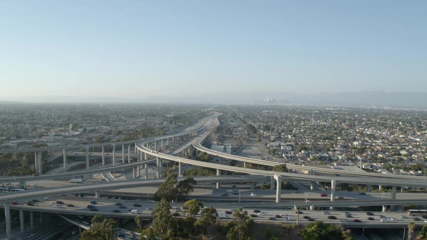 Cars drive on a city highway