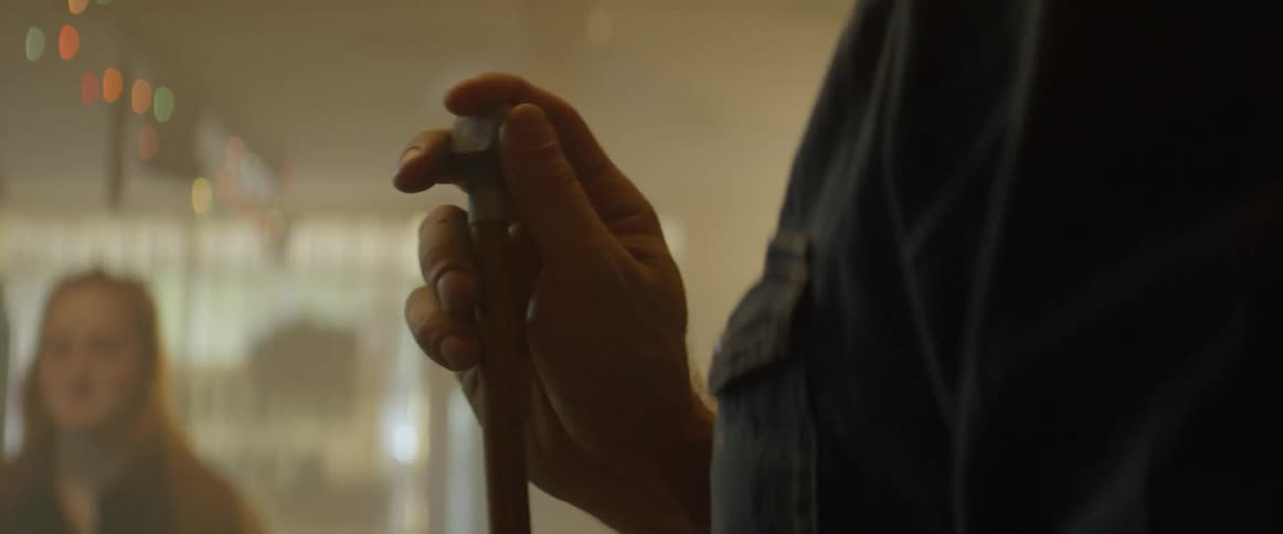 A man chalks a pool cue