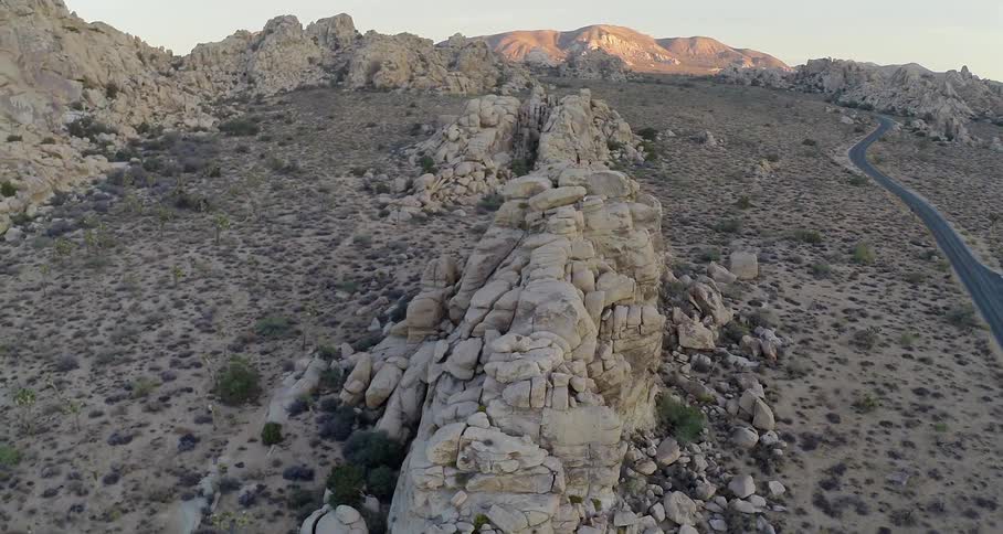 An aerial view of rocky outcroppings in a desert landscape