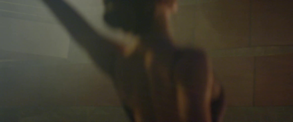 A woman dances on a stage