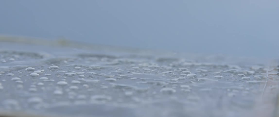 Water is splashing onto a boat deck