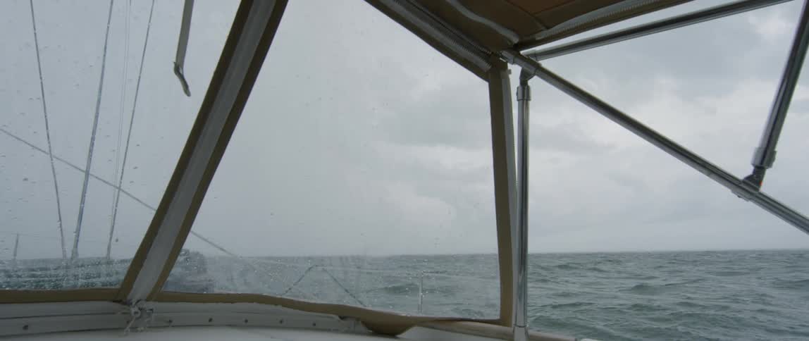 A boat rises and falls on the ocean waves