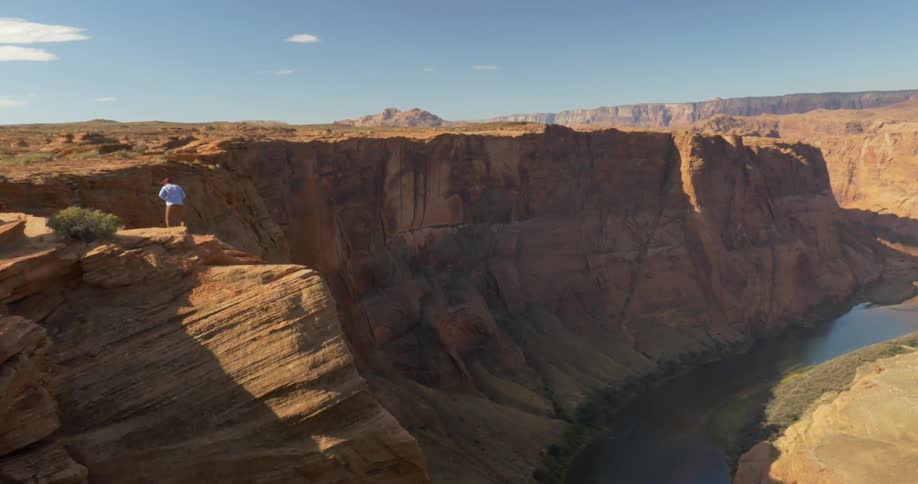 A person sitting on a cliff edge