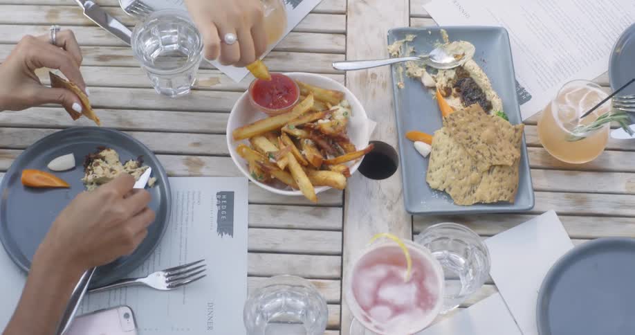Women dine at a wooden table